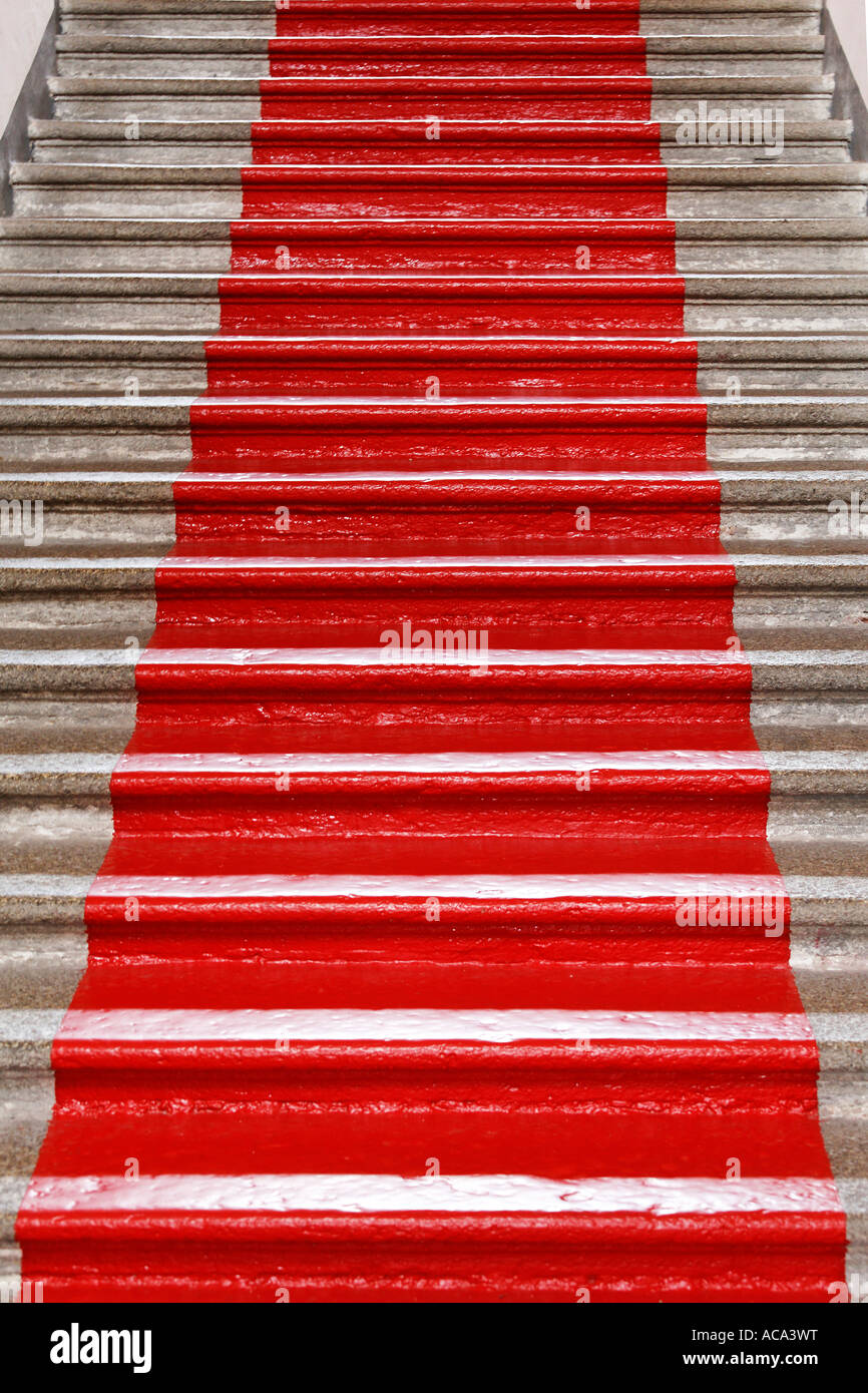 Flight of stairs with painted red carpet Stock Photo