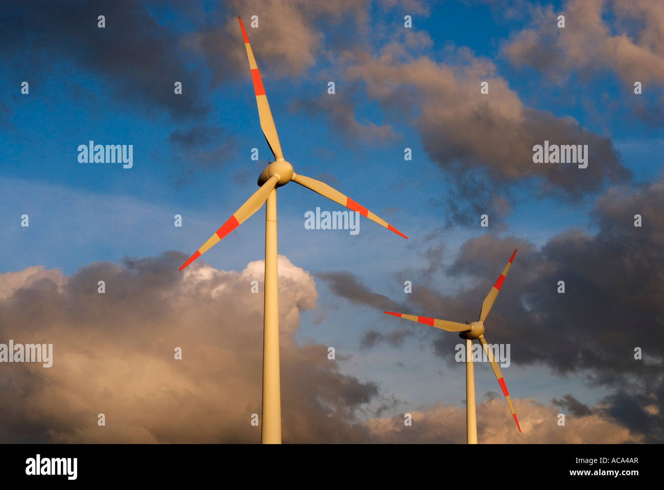 Wind power plant in front of a dramatically clouded sky, Germany Stock Photo