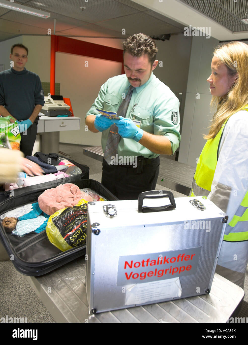 TGSH Veterinary and customs officers checking passengers at the airport, Germany Stock Photo