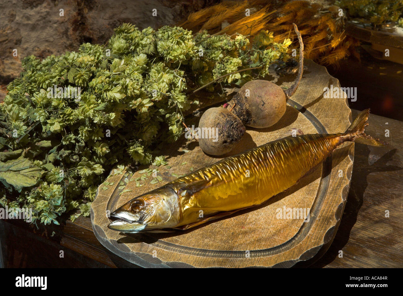 Smoked mackerel with hop and beets on a cutting board Stock Photo