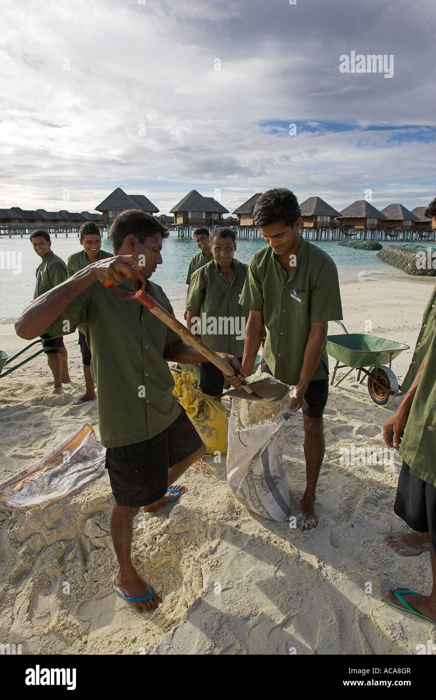 Maldivians fortify the sandy beaches as a protection against Tsunamis and currents, Maldives Stock Photo