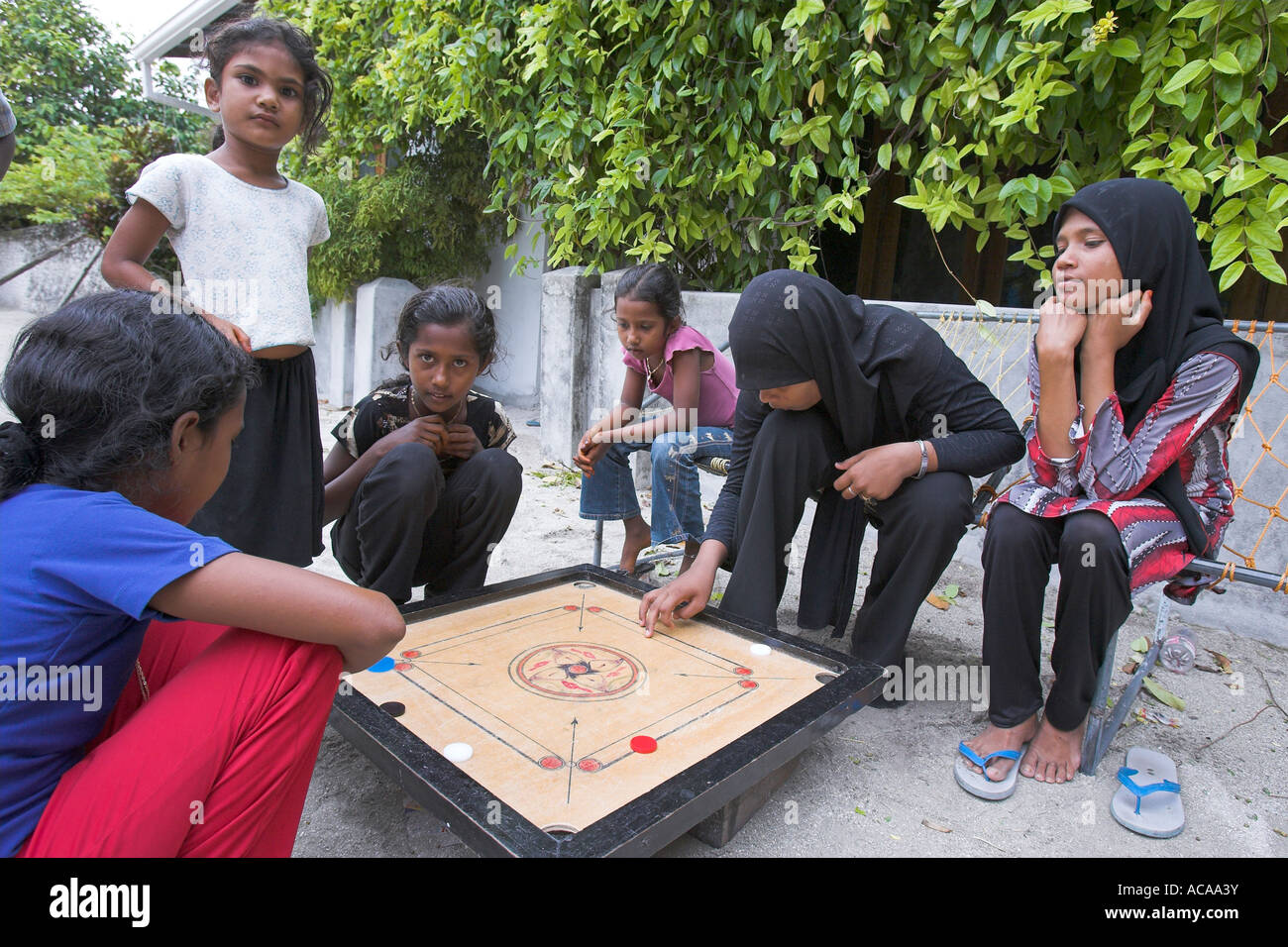 Maldivians are playing the Carrom board-game, Maldives Stock Photo - Alamy