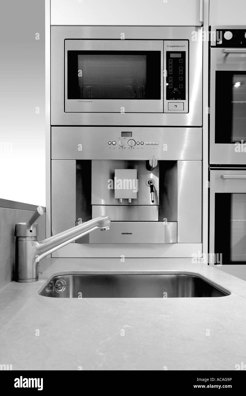 Kitchen interior, stainless steel, oven cooker, sink, tap, microwave, sterile, modern, new, clean, shiny, glitzy, drainer,bake, Stock Photo