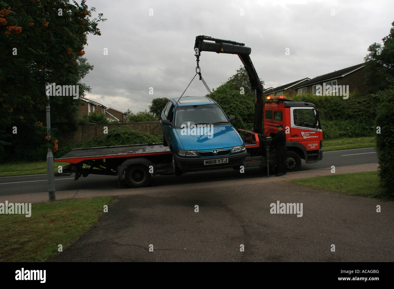 Car lifted by crane onto Scrap Dealers Lorry Stock Photo Alamy