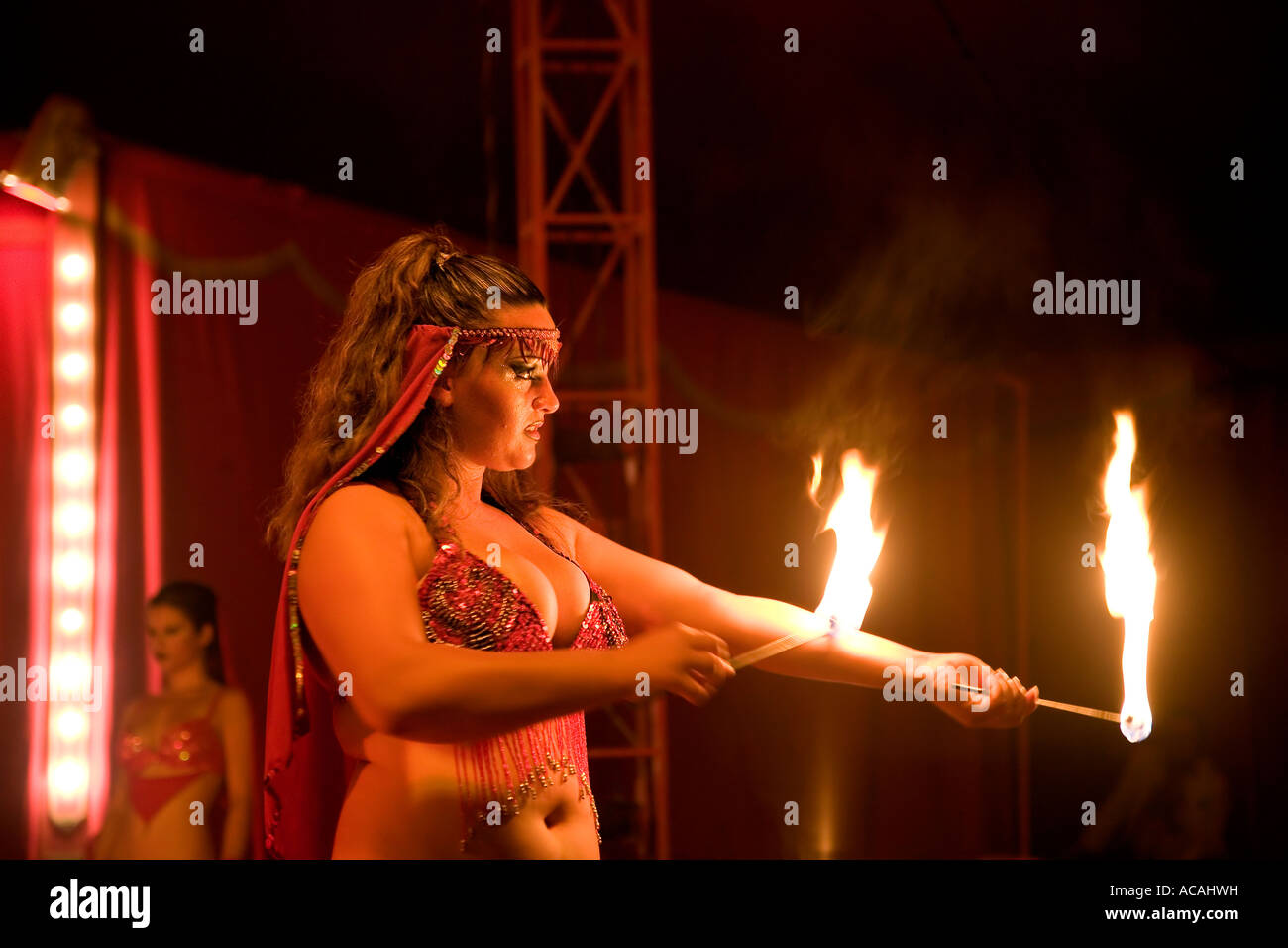 A artiste shows tricks with fire, Monti circus Stock Photo