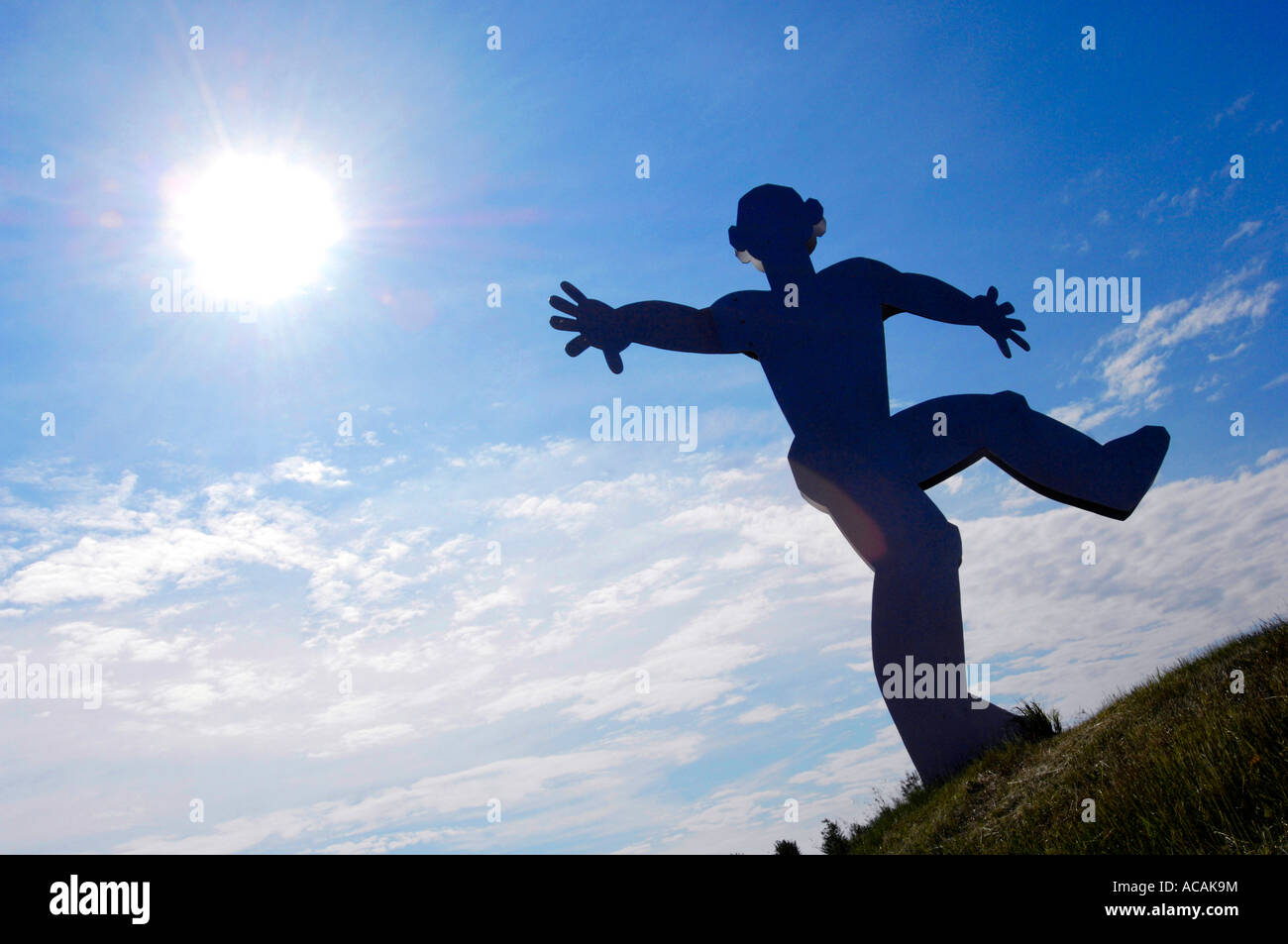 Sculpture of a man with back light Stock Photo - Alamy