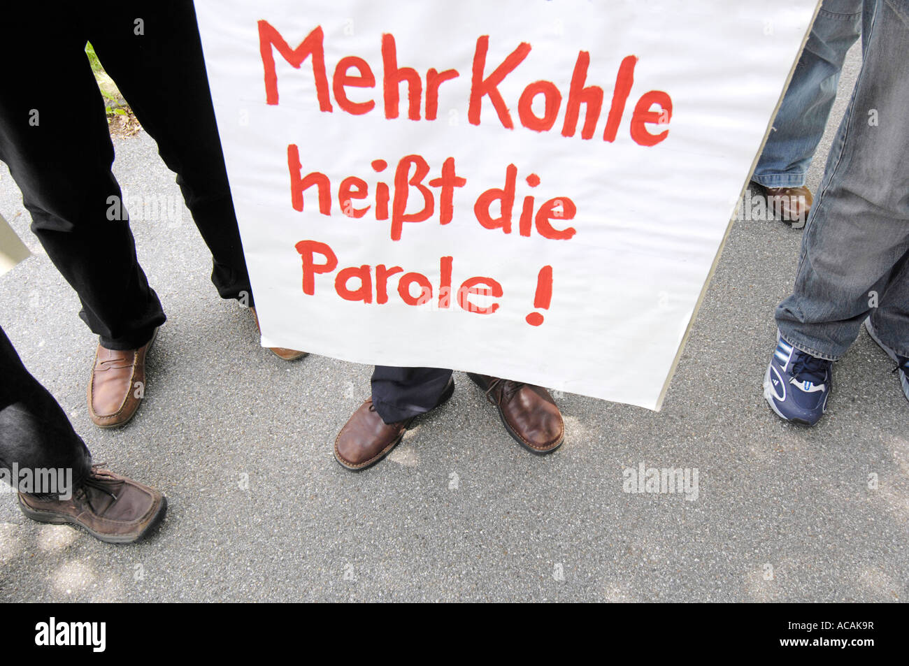 Sign: "The slogan is more income!" Stock Photo