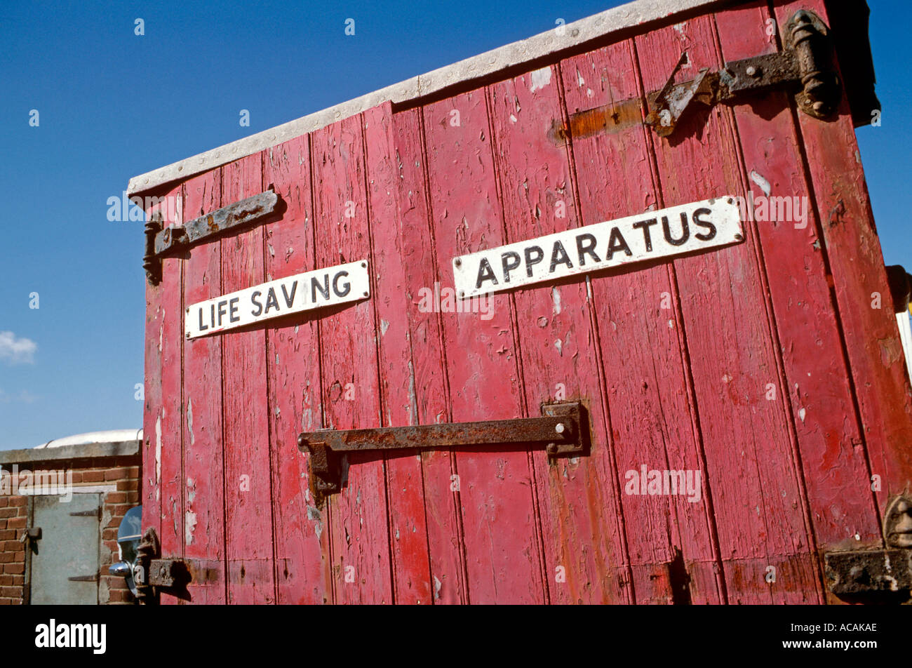 Beach safety equipment, life saving apparatus store in poor neglected vandalised condition Stock Photo
