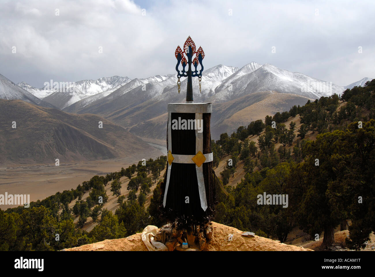 Tibetan Buddhism symbol trident forest of old juniper Juniperus trees