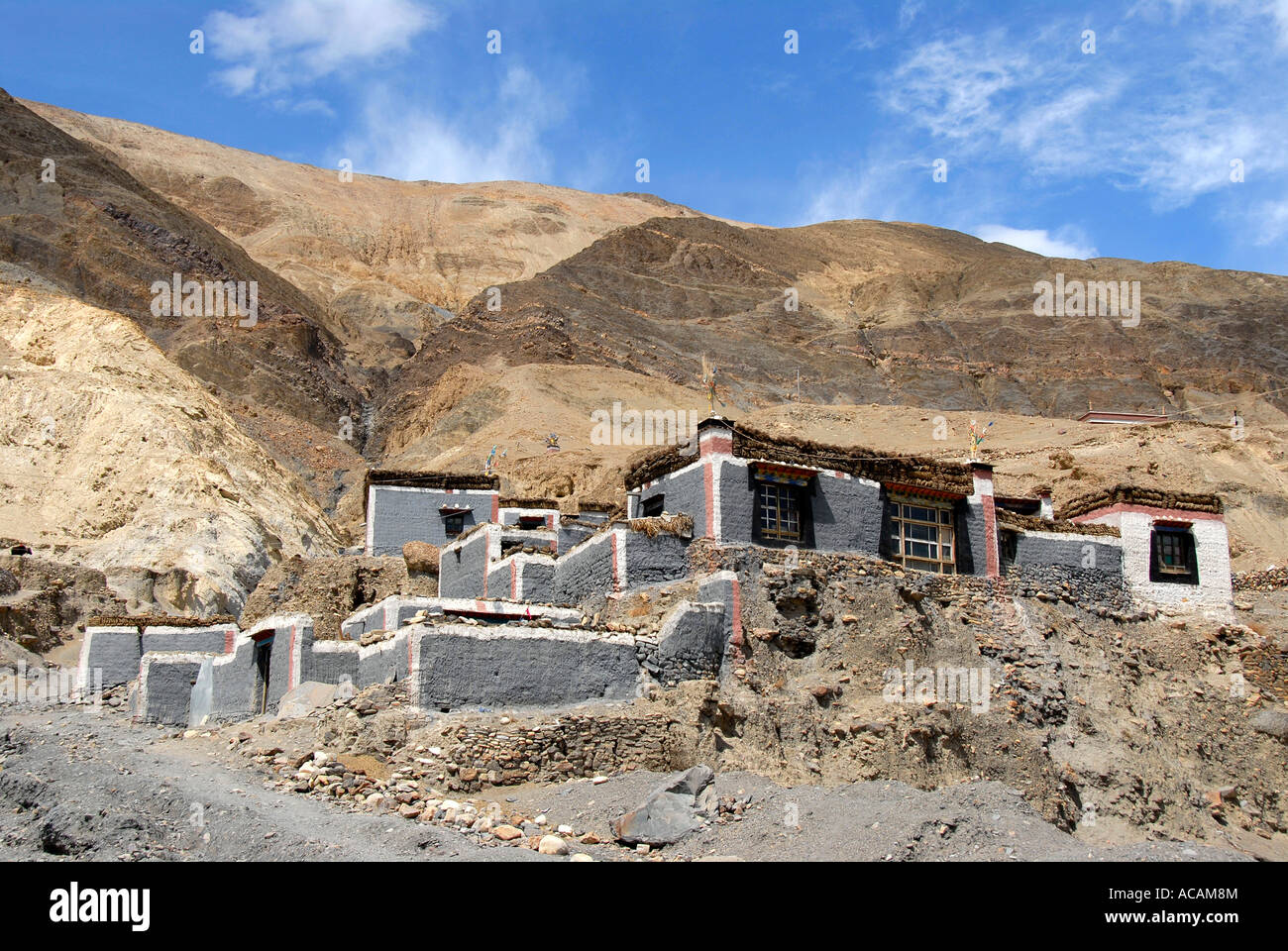 Traditional houses with grey and dark red painted walls at the mountain slope Sakya Monastery Tibet China Stock Photo