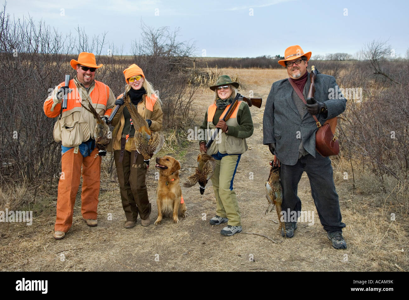 Two Couples Posing with Dog Shotguns and Pheasant during Upland Bird Hunt Near Tipton Kansas
