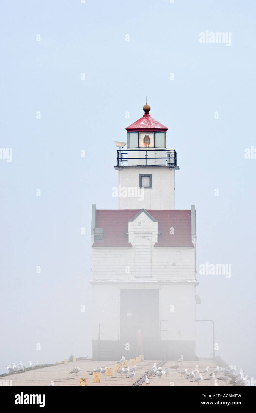 Kewaunee Pierhead Lighthouse Enveloped in Fog Lake Michigan Kewaunee Wisconsin Stock Photo
