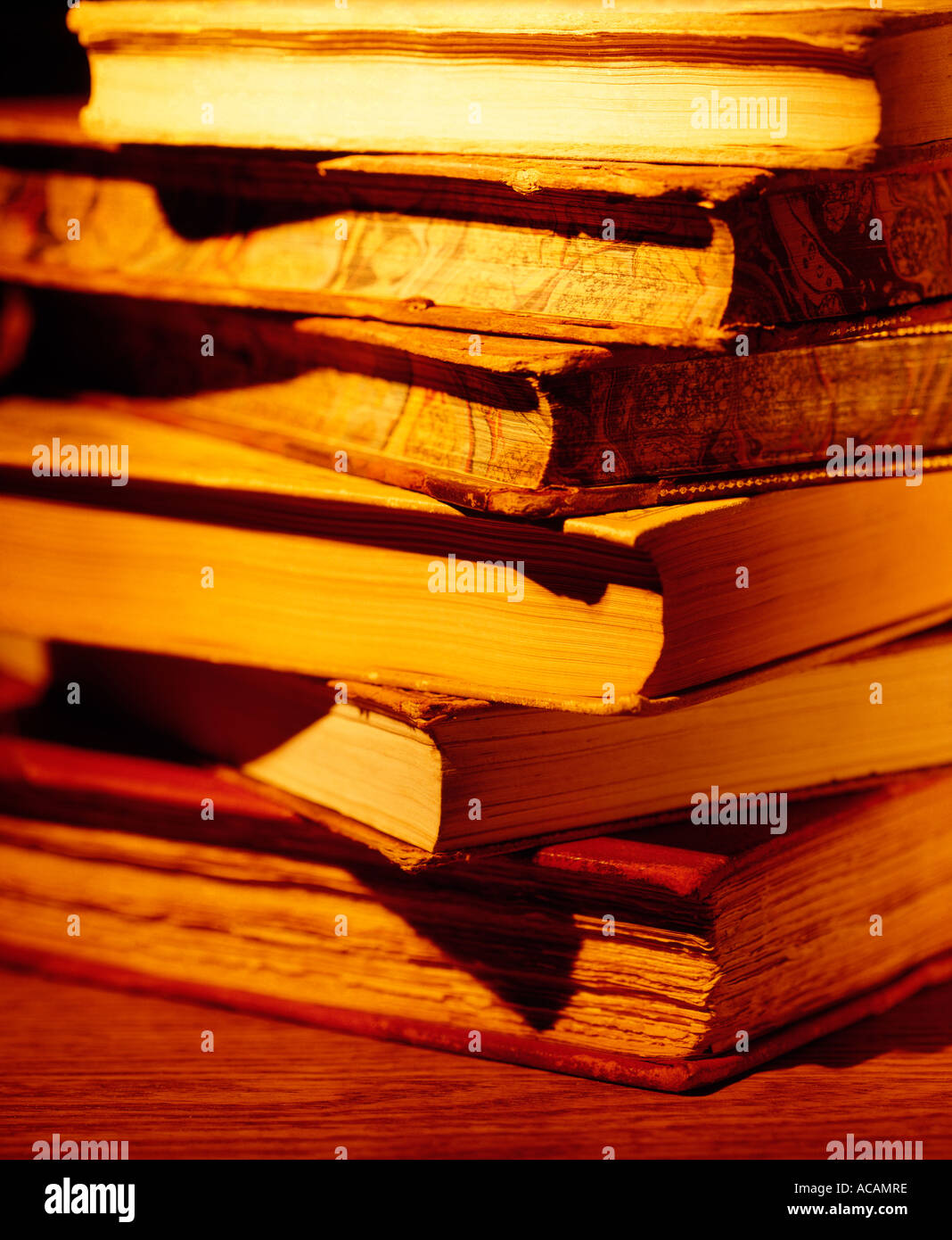 old Books stacked glow Stock Photo Alamy
