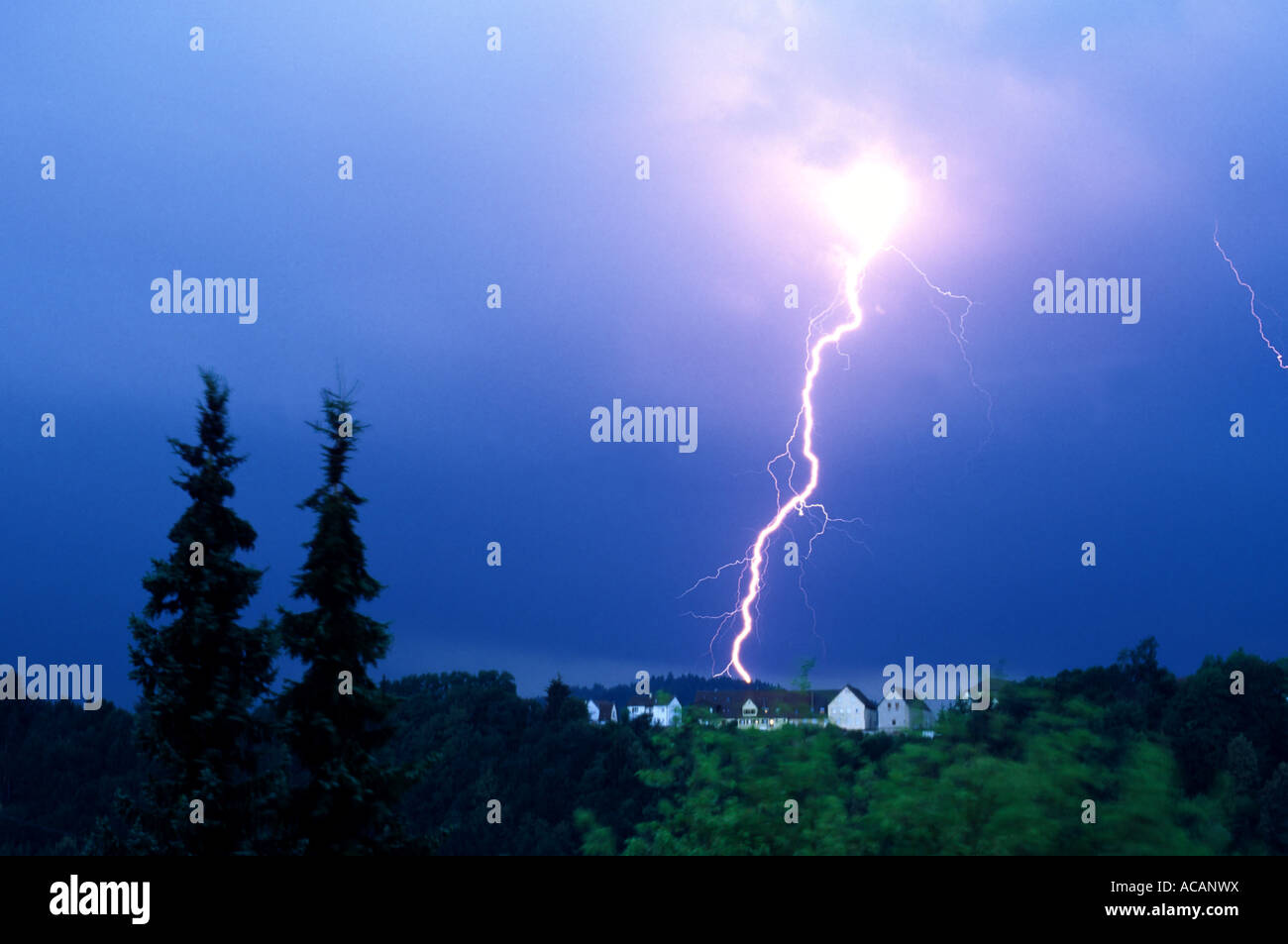 Lightning in the evening sky Stock Photo