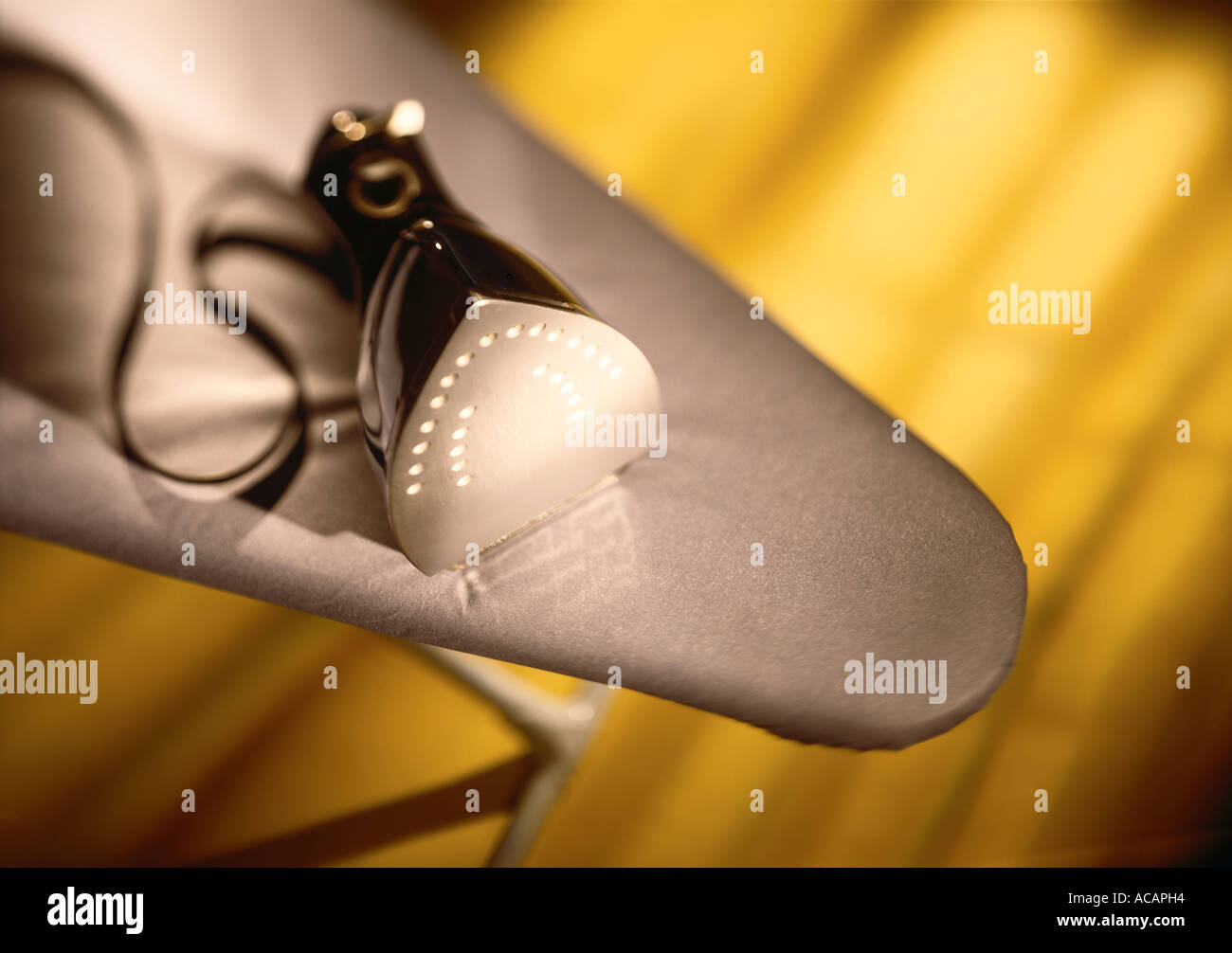 Iron on ironing board Stock Photo Alamy