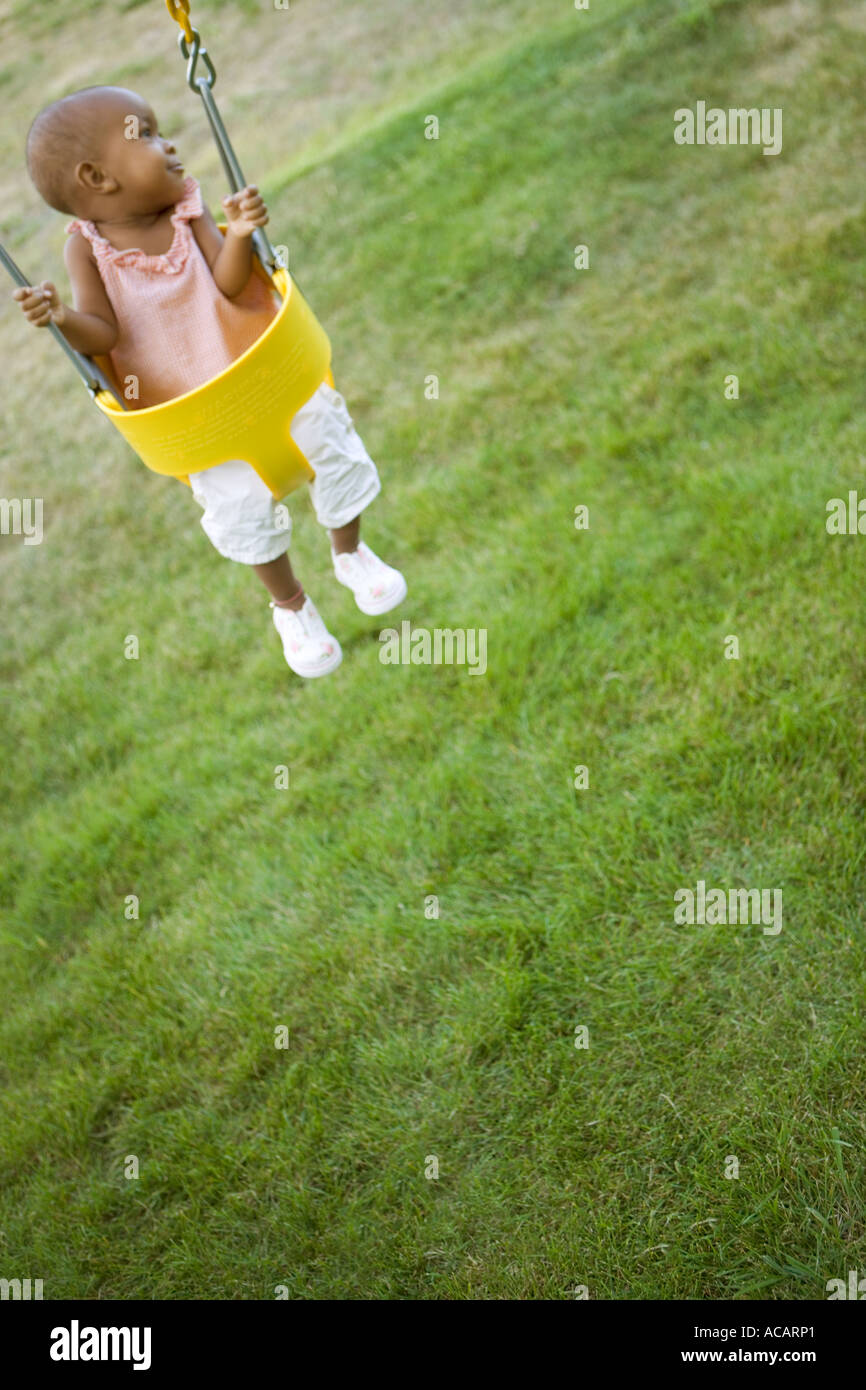 Baby in swing Stock Photo Alamy