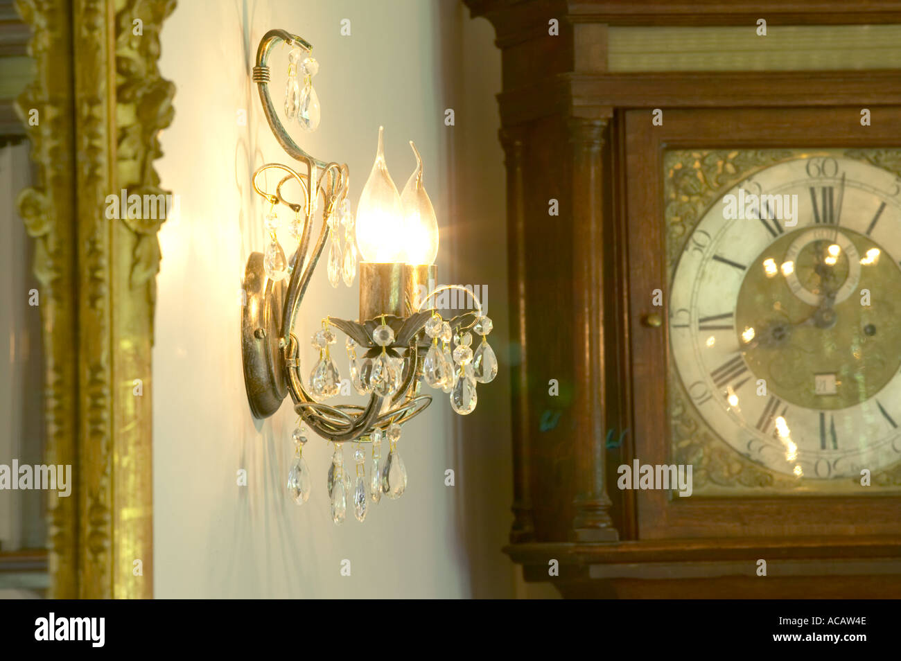 wall light fitting with grandfather clock Stock Photo