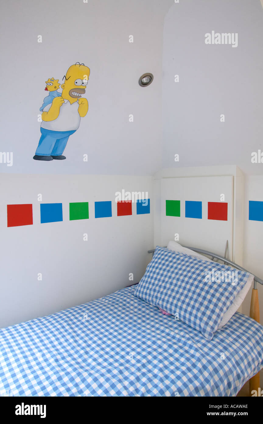 child bedroom of large home with Homer Simpson on wall Stock Photo