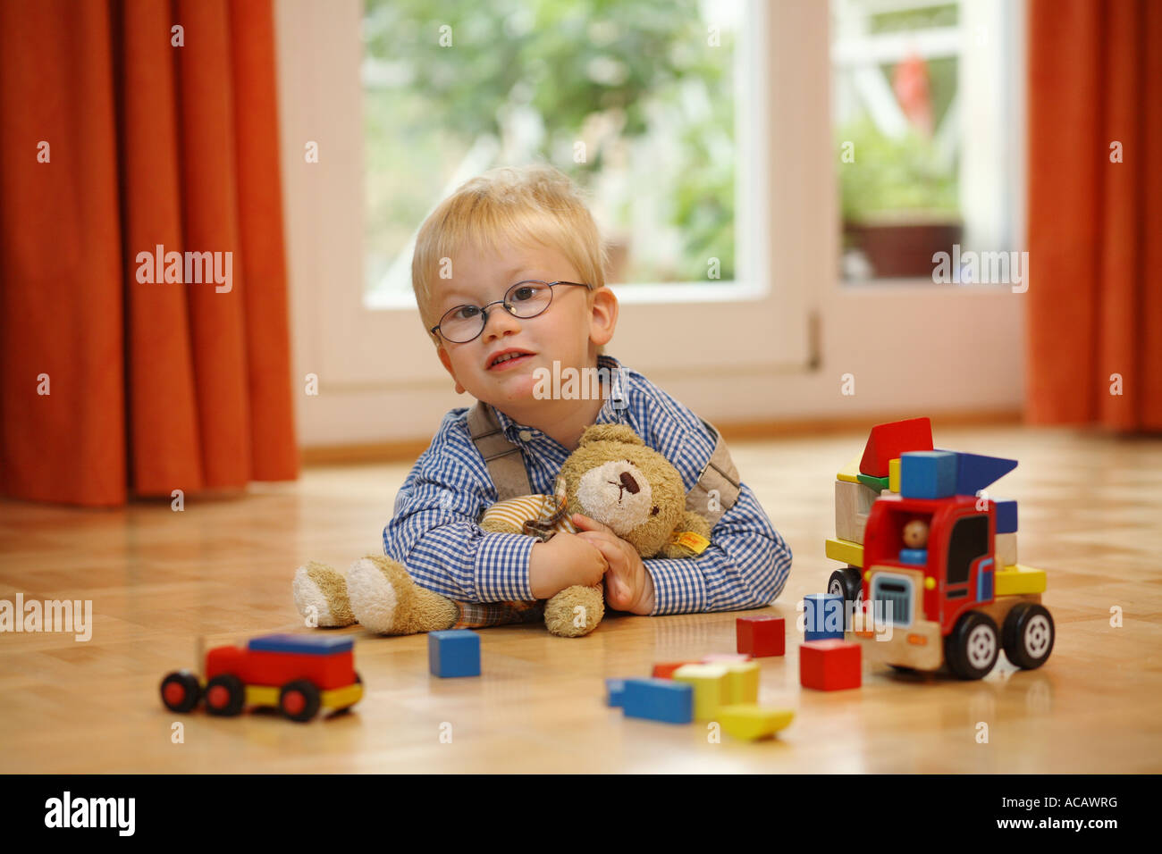 Little boy with teddy bear, Strabismus Stock Photo