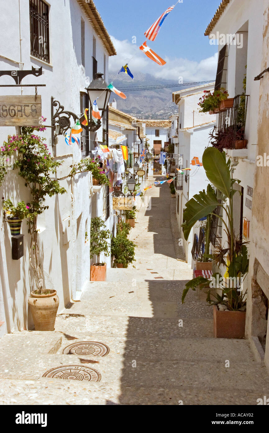 Traditional white washed houses in narrow street Old Town Altea near