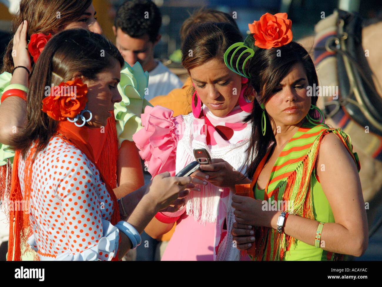 Girls in brilliantly coloured flamenco dresses party at the April Fair