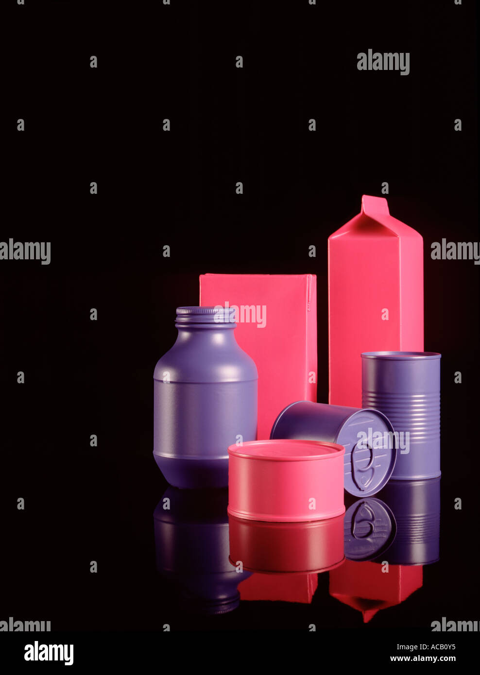 Generic food containers painted magenta and blue on black reflective ...