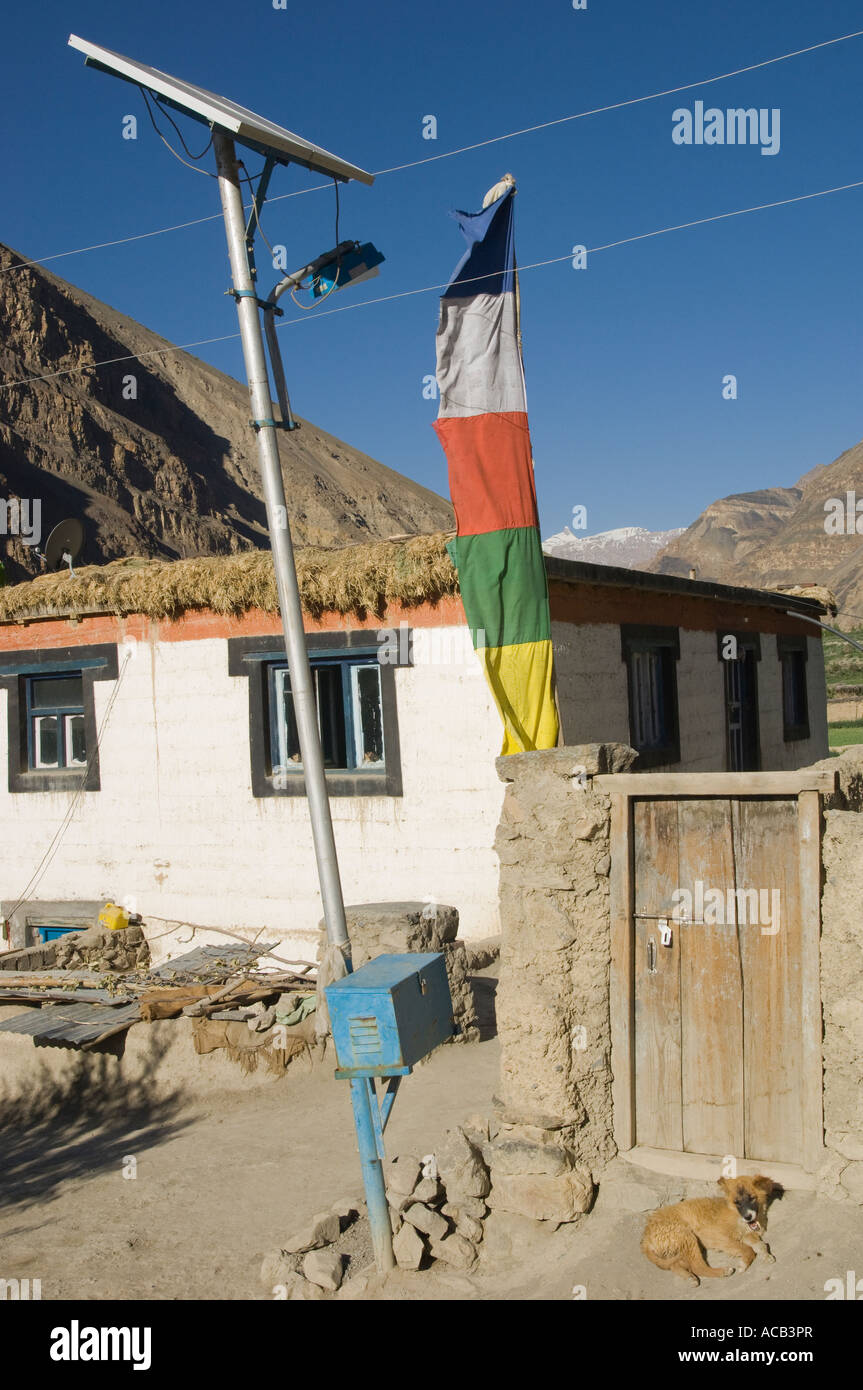 India Himachal Pradesh Spiti Tabo village street lamp solar powered with typical house prayer flag and mountain in bkgd Stock Photo