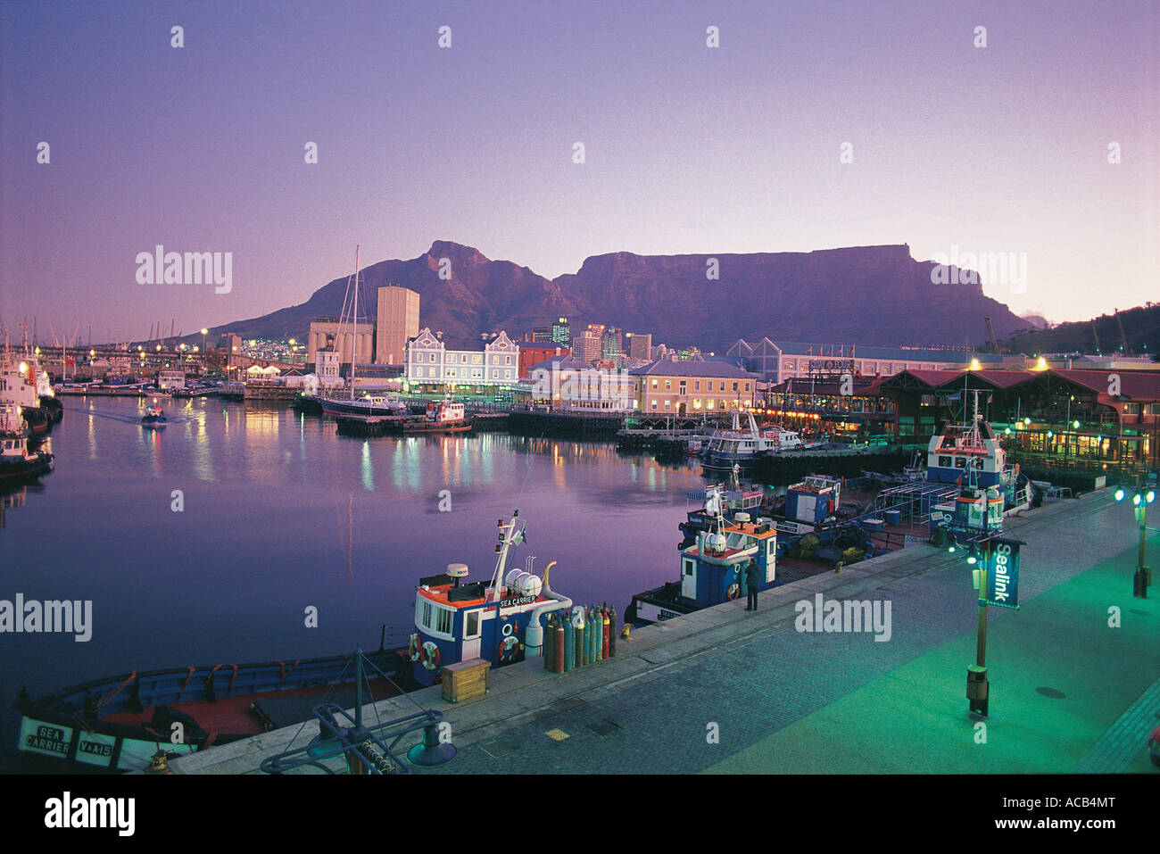 Table Mountain at dusk Victoria and Alfred Waterfront in foreground Cape Town South Africa Stock Photo