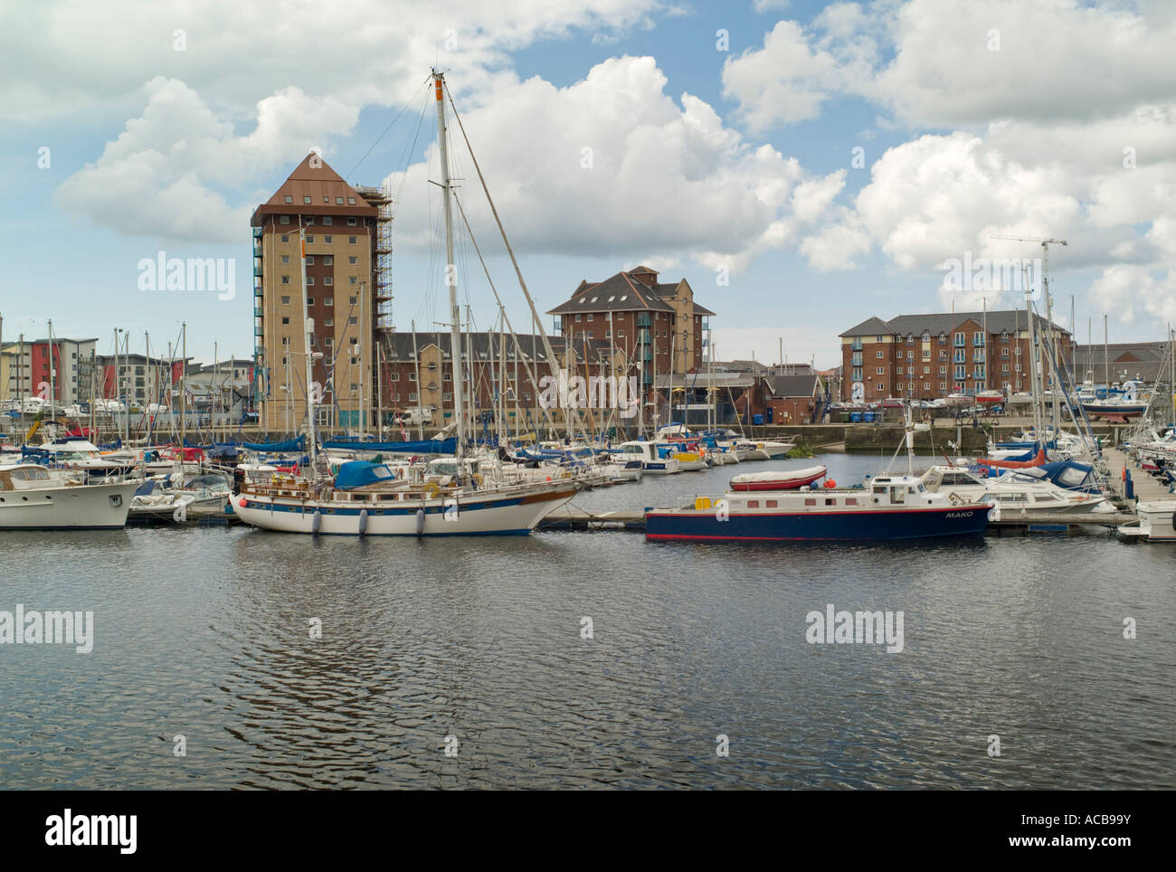 Swansea marina yachts boats in the docks with new apartments flats
