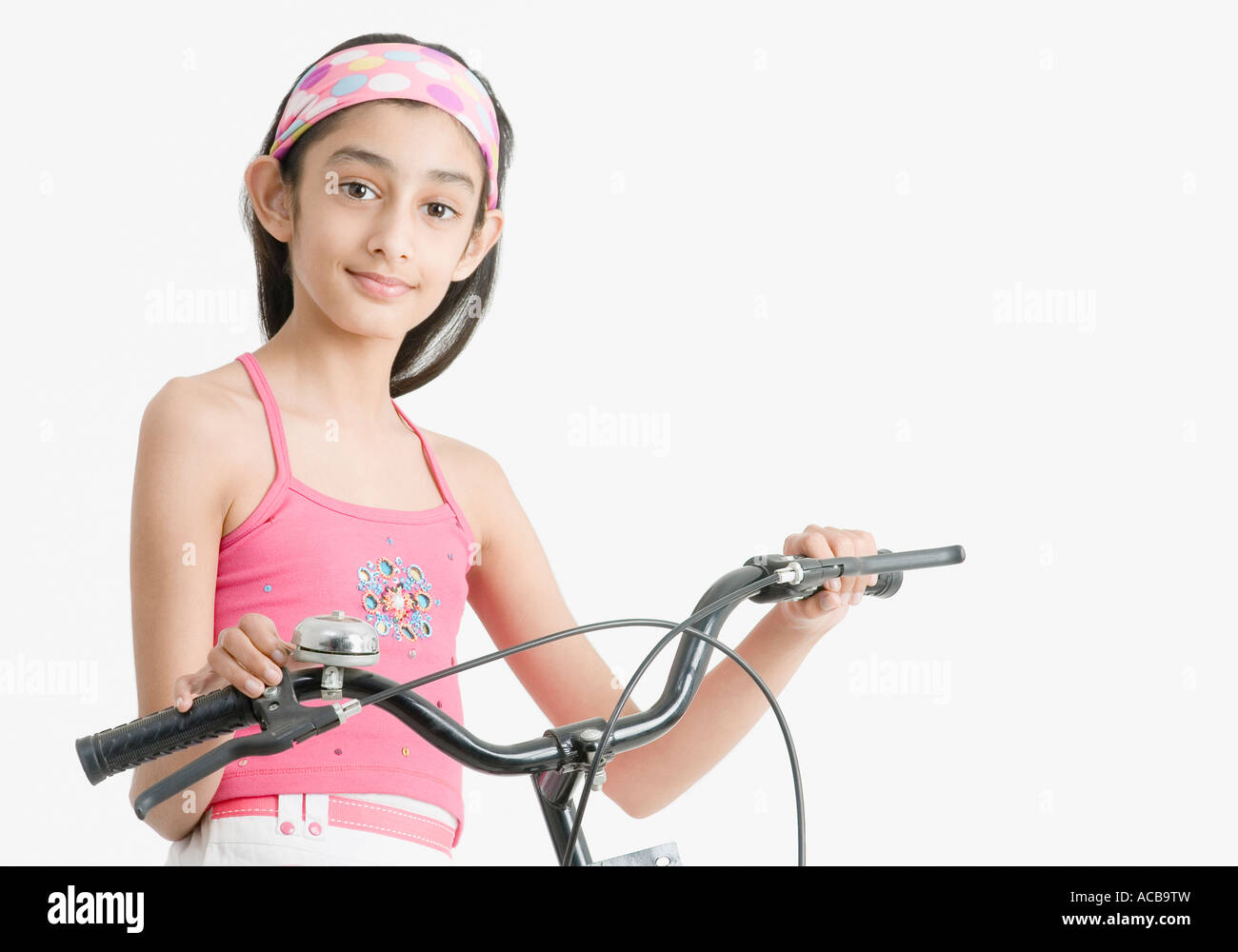 Portrait of a girl holding the handlebar of a bicycle Stock Photo Alamy