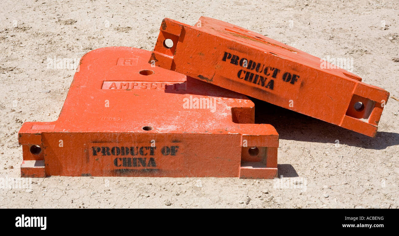 Parts of an oil pump made in China on an oil field in West Texas Stock