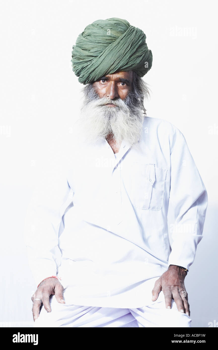 Portrait of a senior man sitting Stock Photo - Alamy