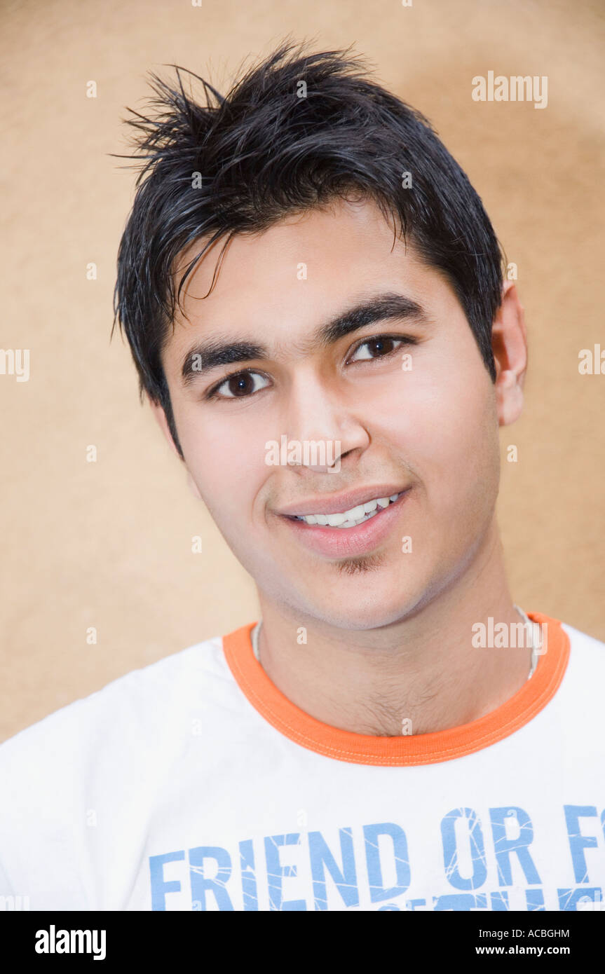 Portrait of a young man smiling Stock Photo - Alamy