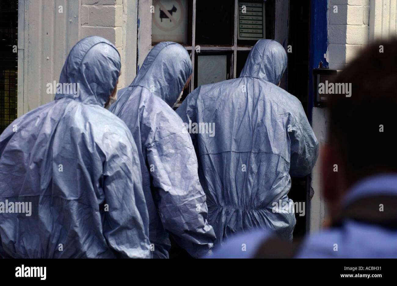 Police officers during raid on islamic book store in Bude Street, in Leeds, 2005 Stock Photo