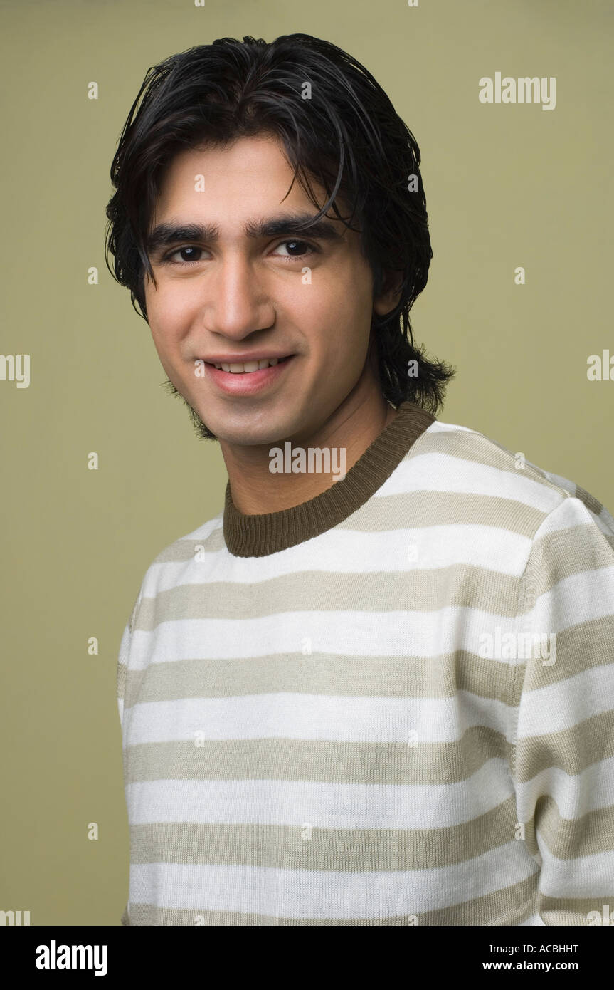 Portrait of a young man smiling Stock Photo - Alamy