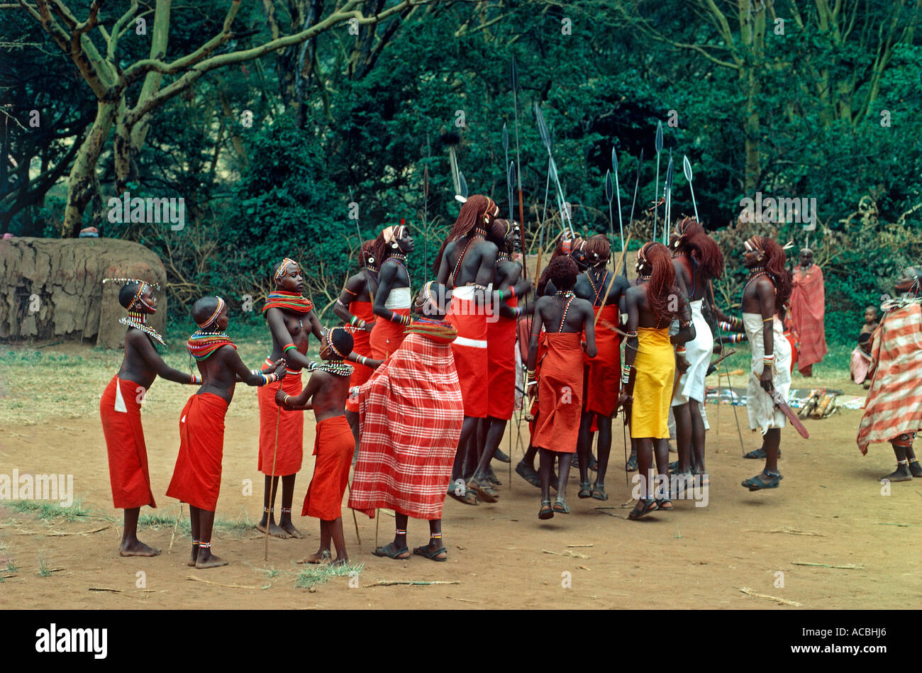 portrait of warriors and women of massai tribe dancing kenya editorial use only Stock Photo