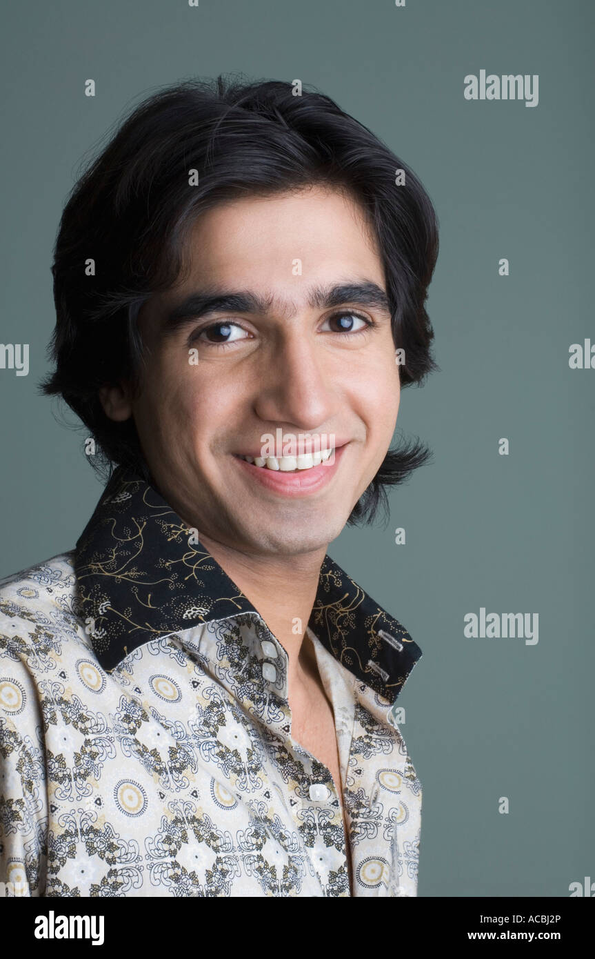 Portrait of a young man smiling Stock Photo - Alamy
