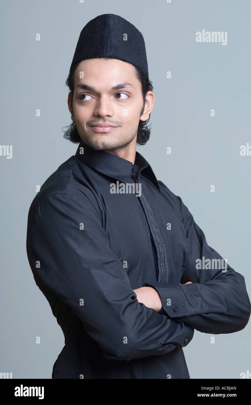 Side profile of a young man with his arms crossed Stock Photo Alamy