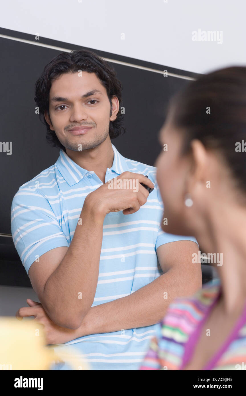 Young man and a young woman in the office Stock Photo - Alamy