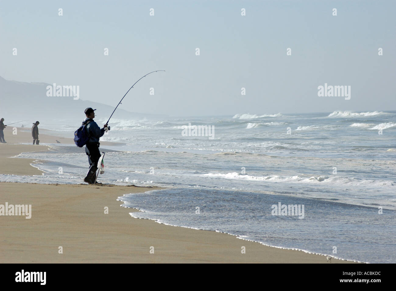 Surfing and surf fishing on Guadalupe Beach in central California with high  waves and no fish in Pacific Ocean in America USA Stock Photo - Alamy