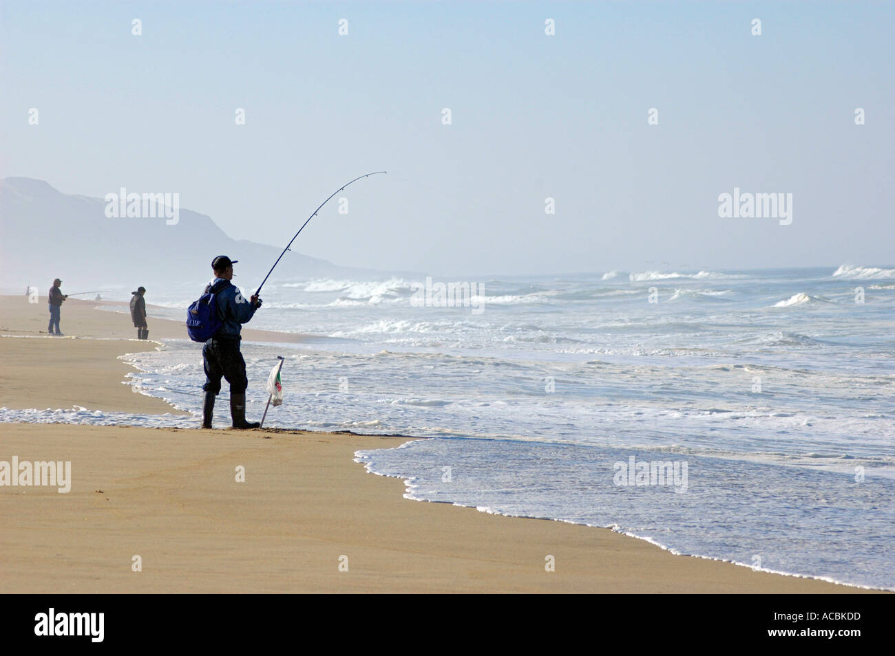 Surfing and surf fishing on Guadalupe Beach in central California with