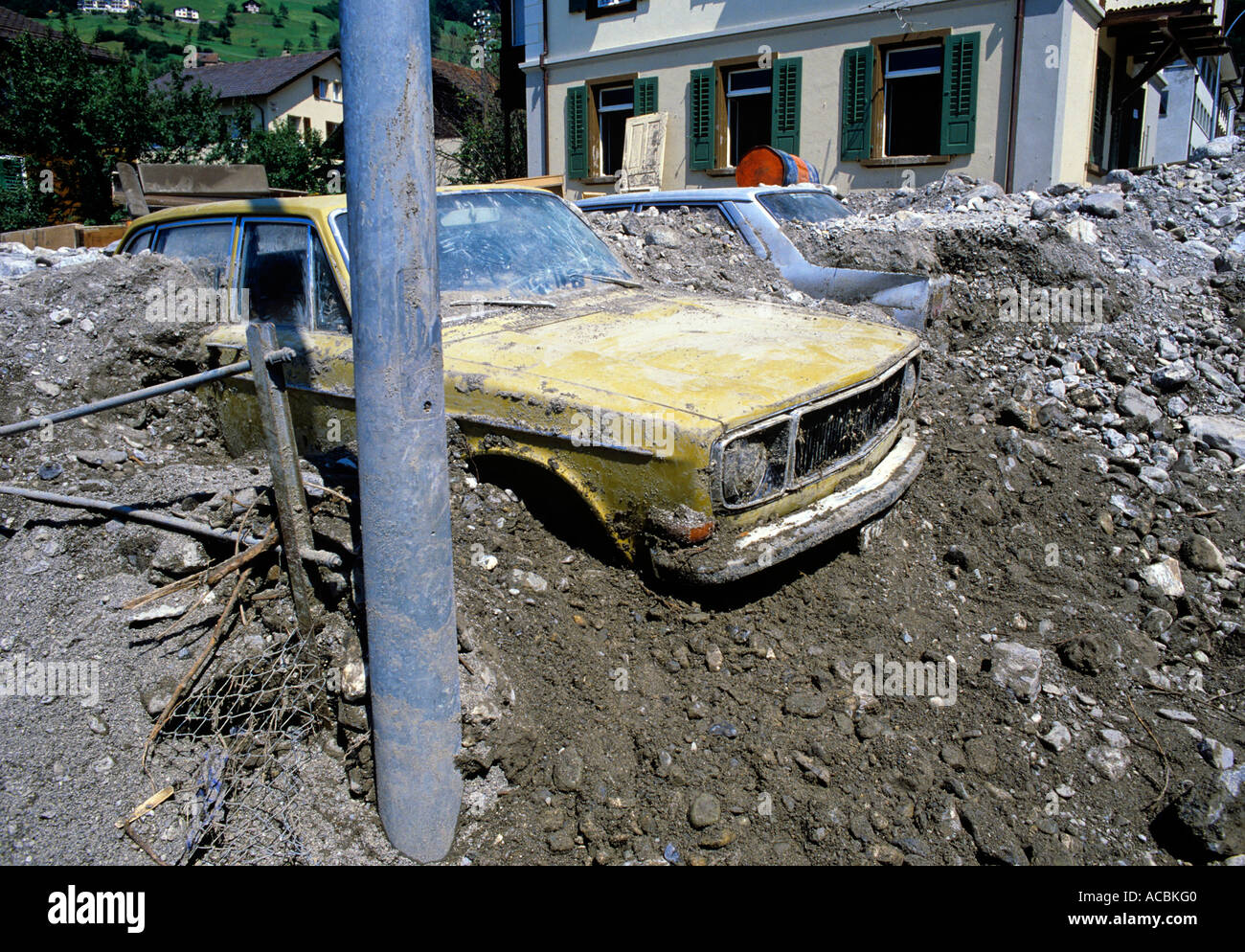 cars and village devastated after mudslide clearance of debris european alpes editorial use only Stock Photo