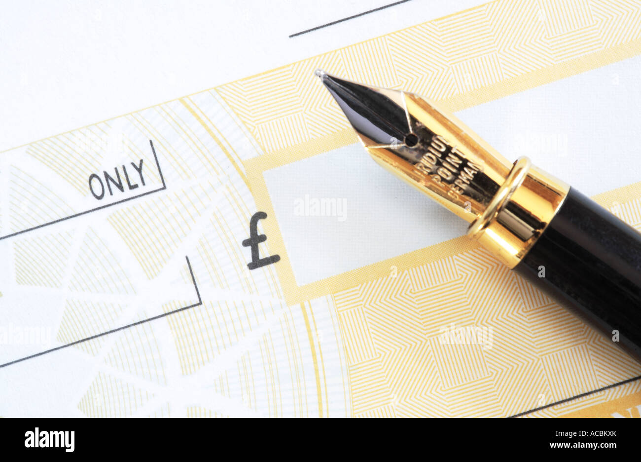 Pen on cheque book Stock Photo Alamy