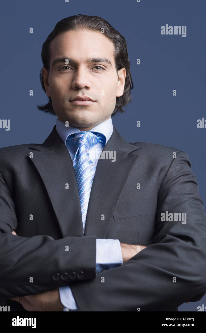 Portrait of a businessman standing with his arms crossed Stock Photo ...