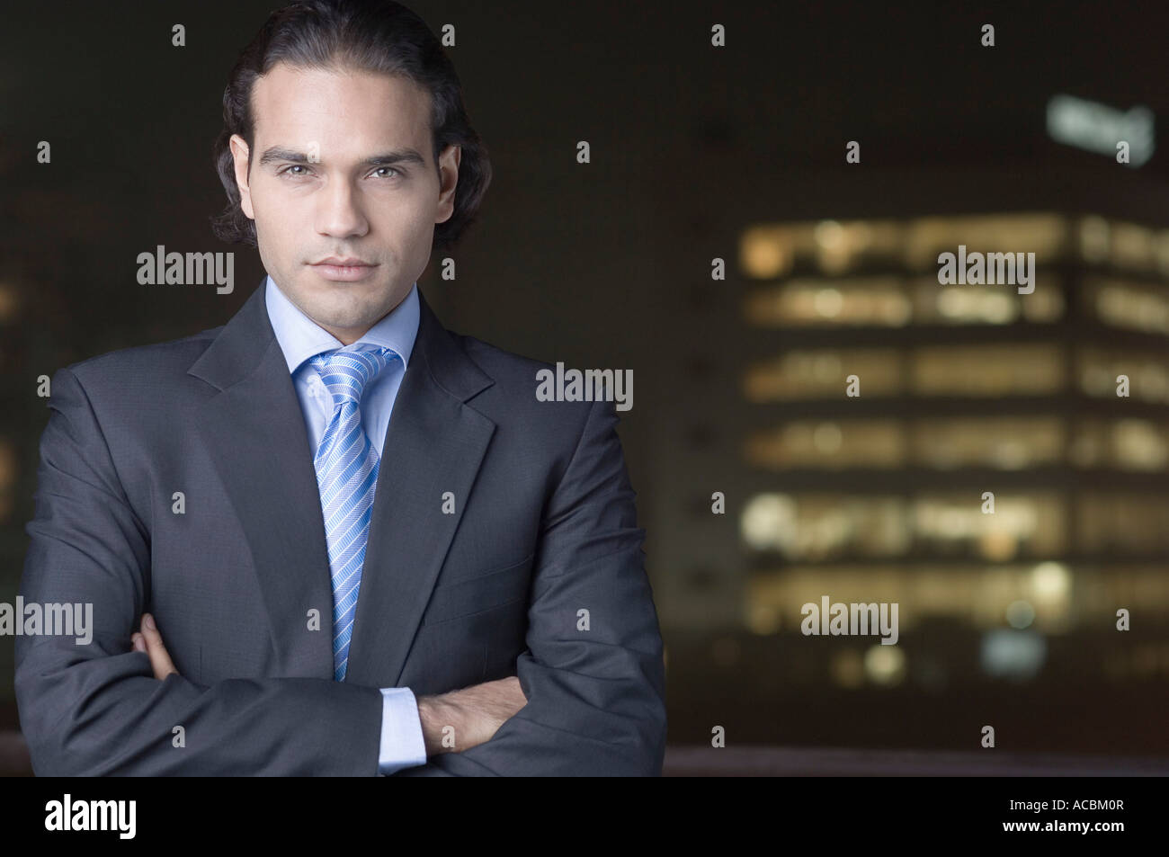 Portrait of a businessman standing with his arms crossed Stock Photo ...