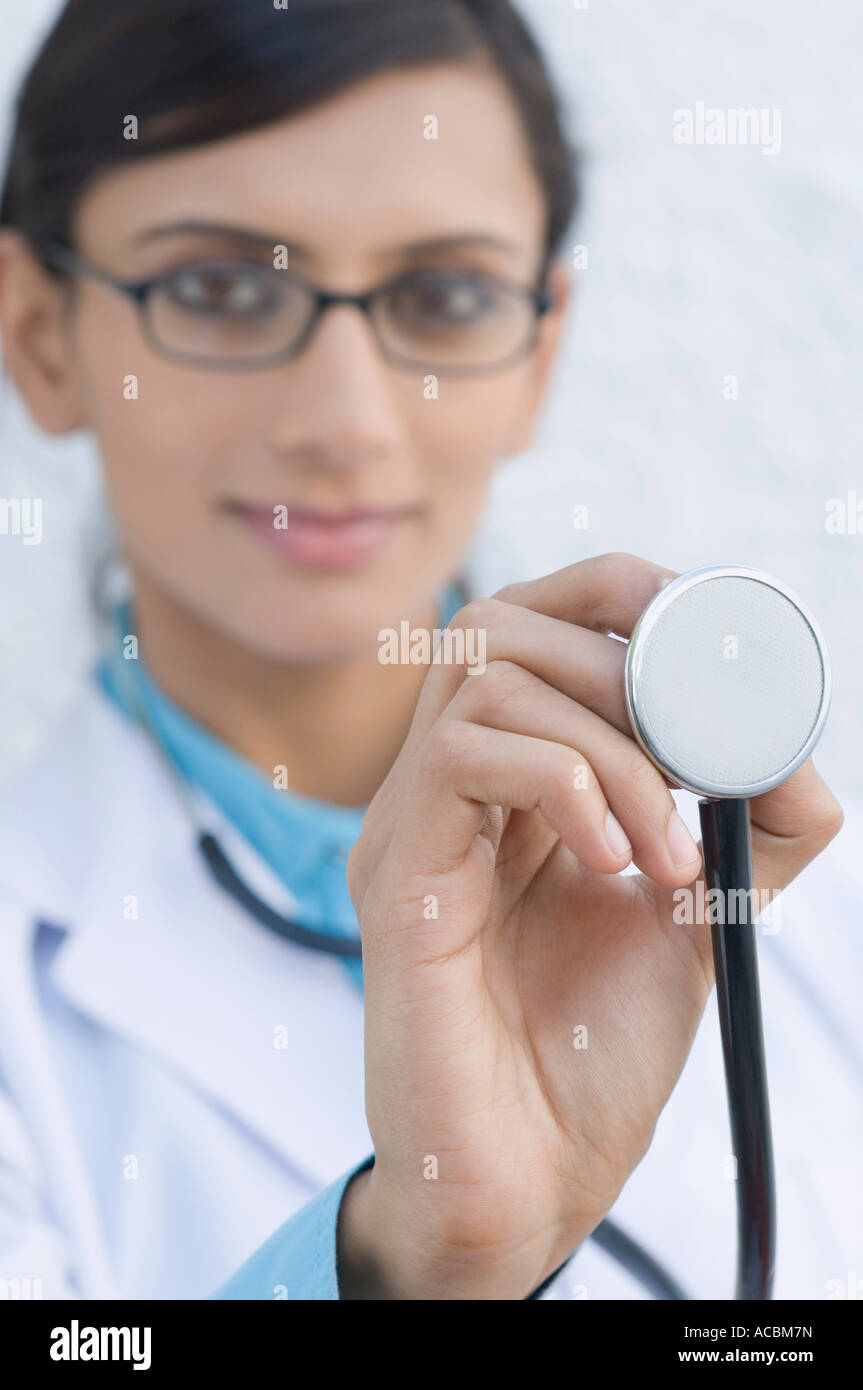 Portrait of a female doctor holding a stethoscope Stock Photo