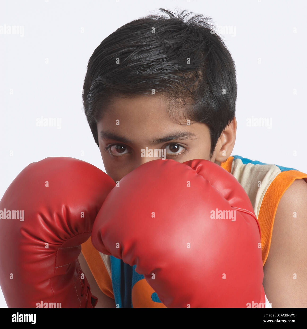 Portrait of a boy wearing a boxing glove Stock Photo Alamy