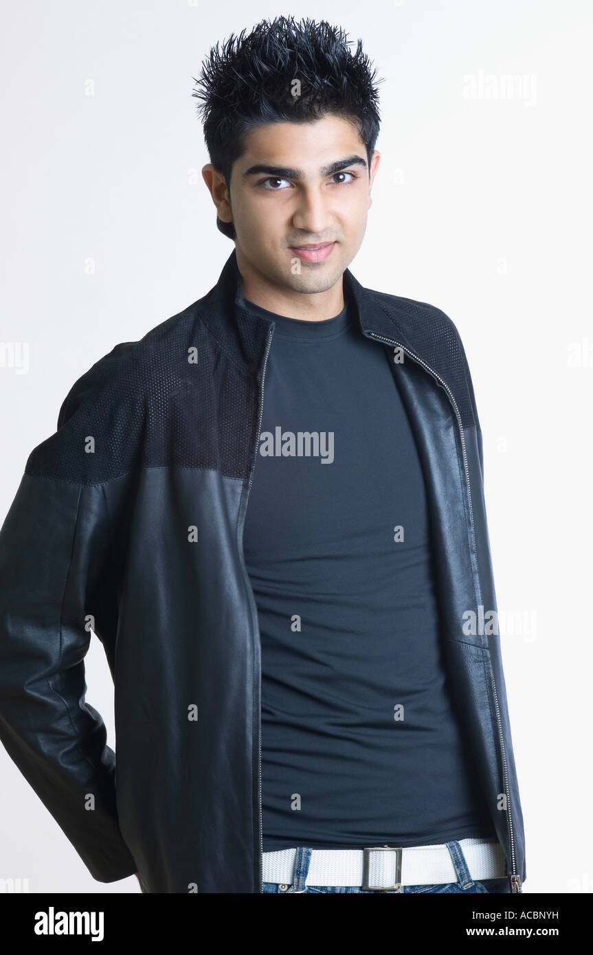 Portrait of a young man standing Stock Photo - Alamy