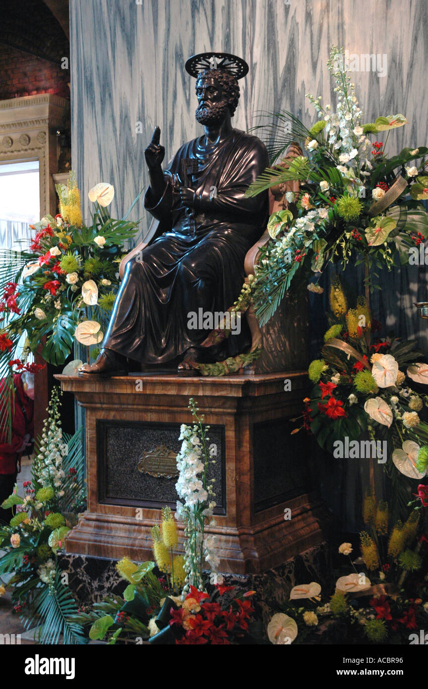 ST PETERS STATUE IN WESTMINSTER RC CATHEDRAL DURING FLOWER FESTIVAL LONDON UK Stock Photo