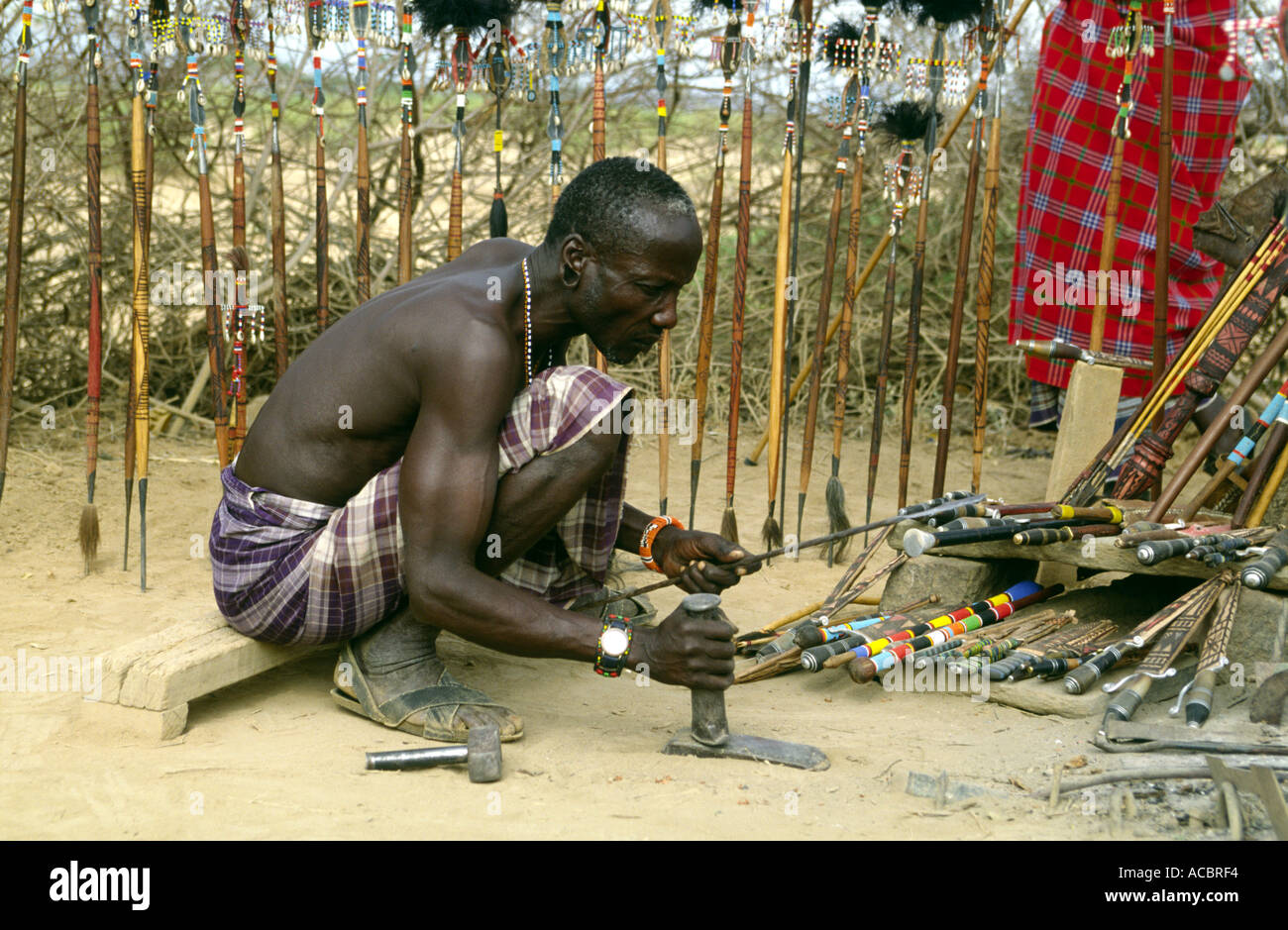 Blacksmith manufacturing traditional spears Samburu National Park Kenya East Africa Stock Photo